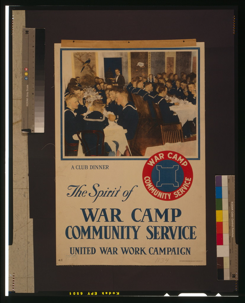 A photograph of a vintage poster. It has an image of rows of white men in navy uniforms eating in a dining hall, with the caption "a club dinner." It has a small blue and red logo with the words "war camp community service" around the outside. In big font, the bottom half of the poster reads "The Spirit of War Camp Community Service United War Work Campaign". 